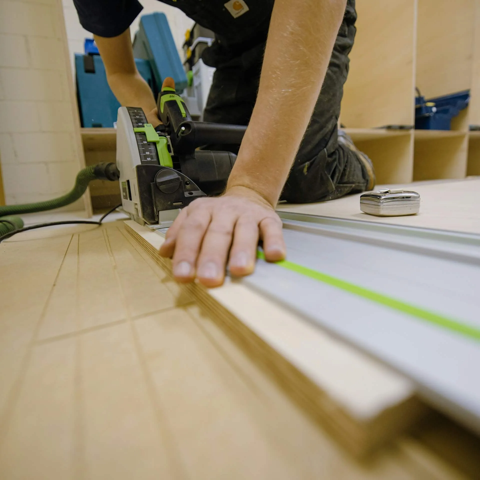 Carpenter cutting timber for fitted joinery work