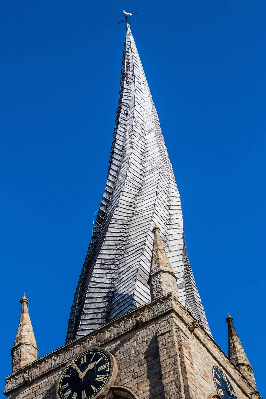 The Crooked Spire church tower in Chesterfield against a clear blue sky