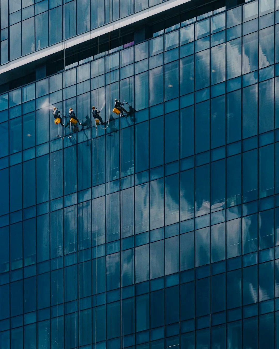 Window cleaner using a squeegee